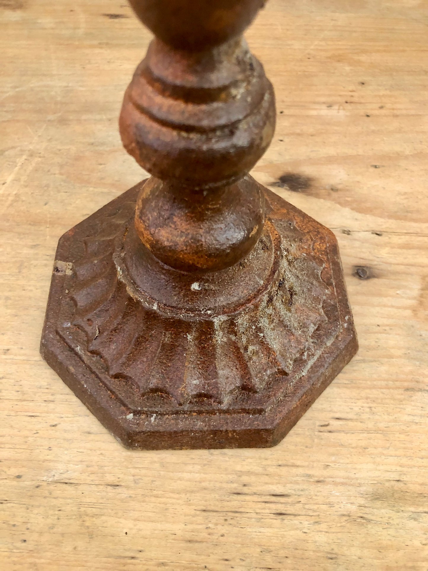 Pair of aged iron candlesticks