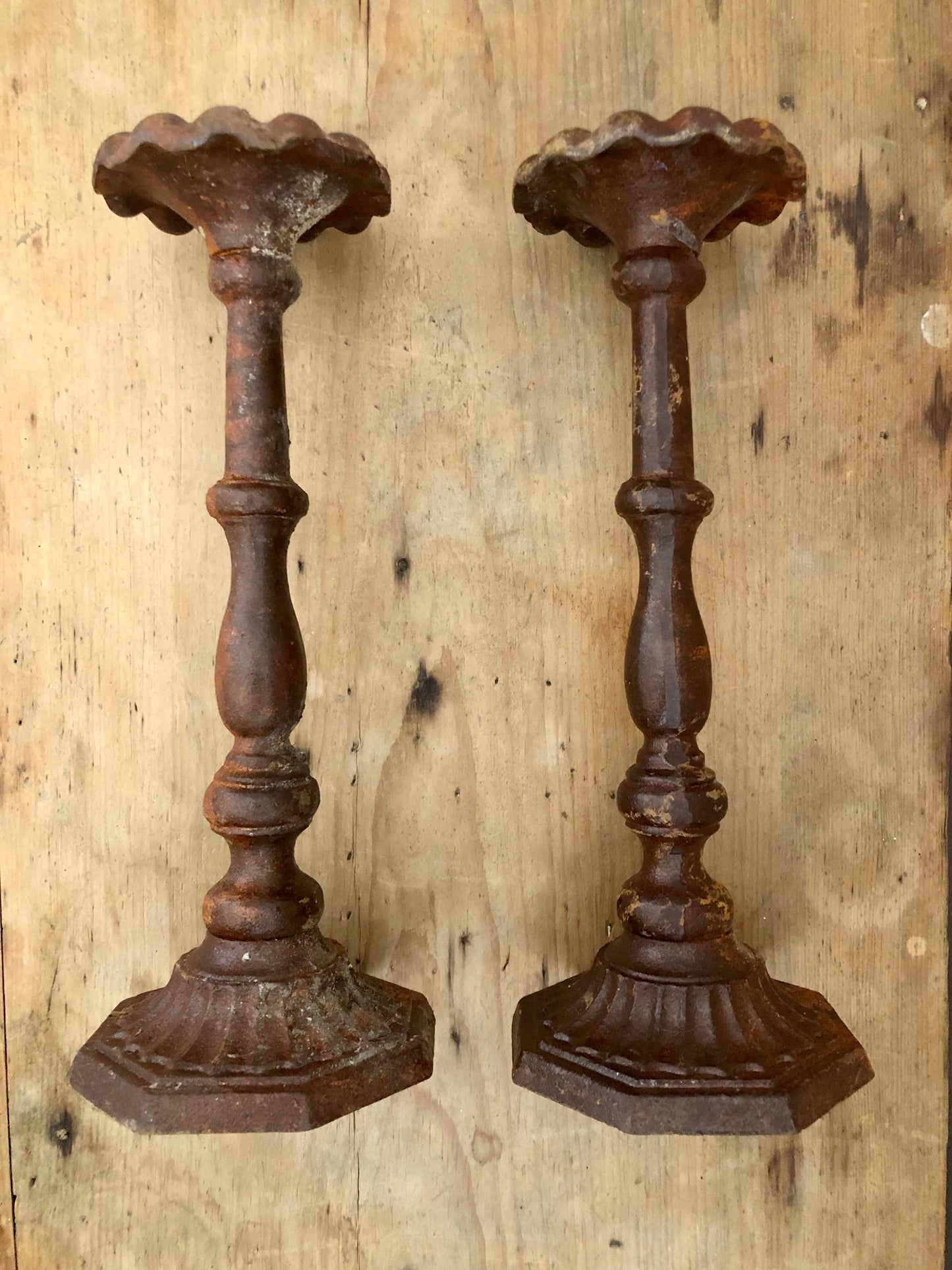 Pair of aged iron candlesticks