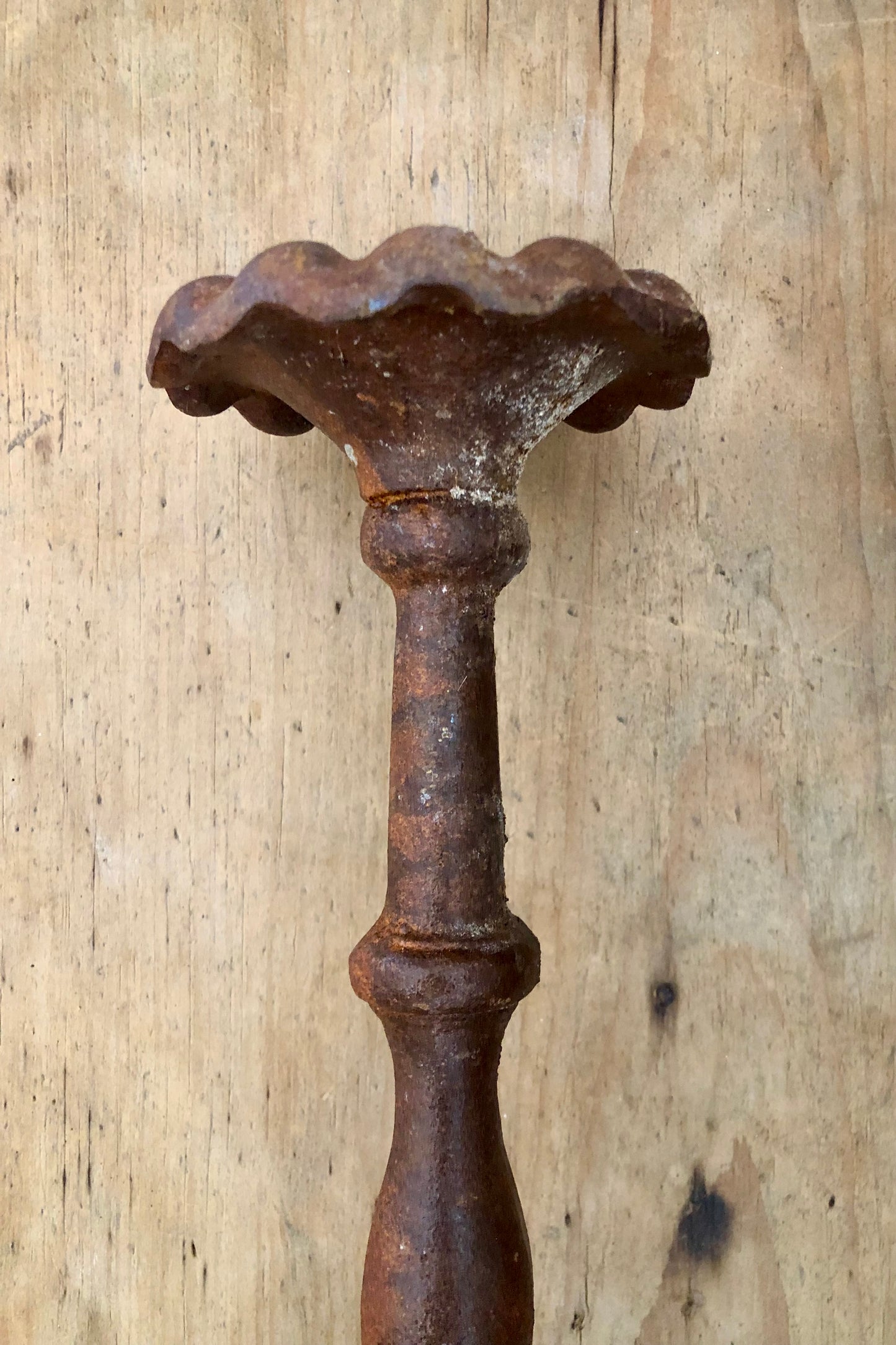 Pair of aged iron candlesticks