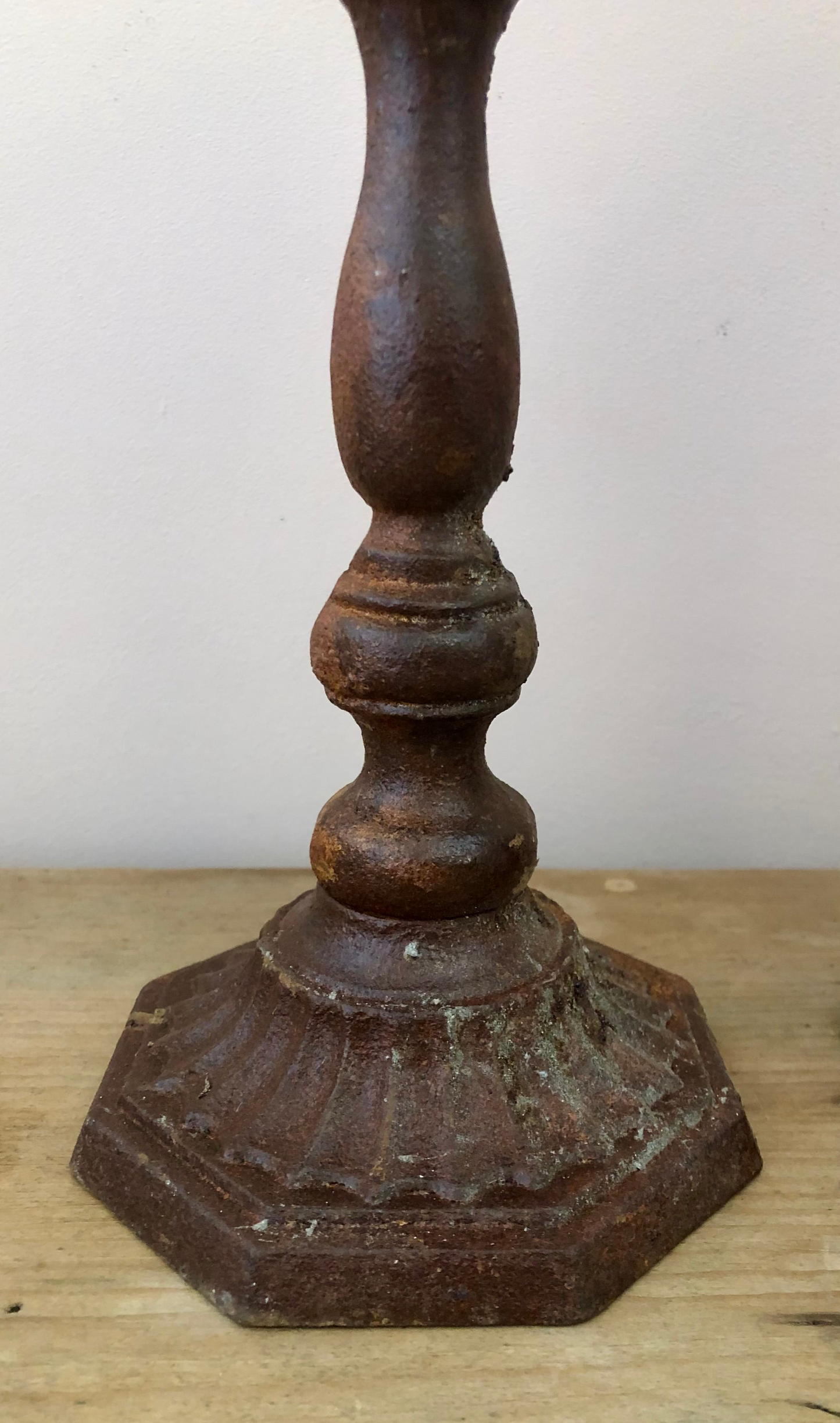 Pair of aged iron candlesticks