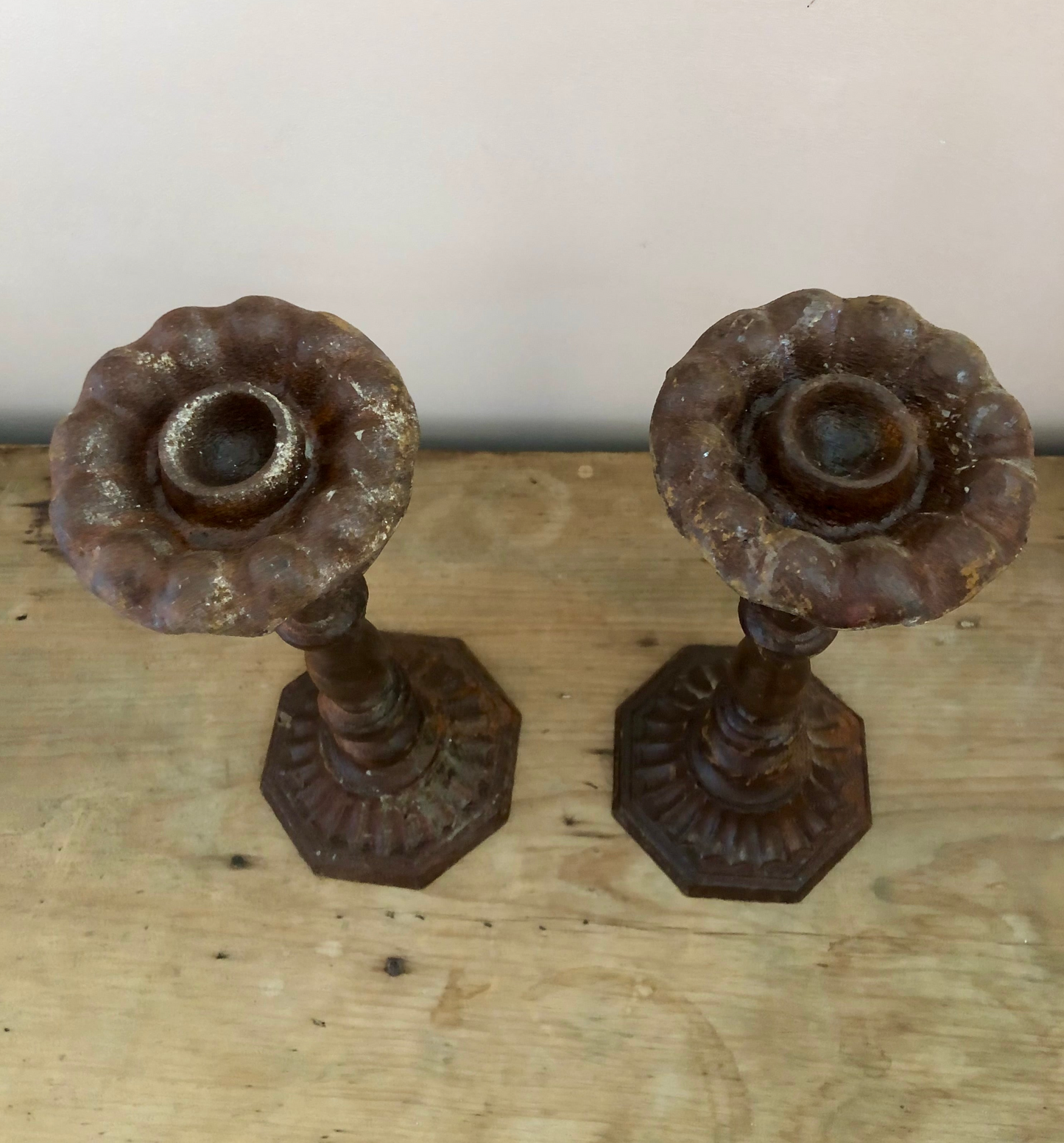 Pair of aged iron candlesticks