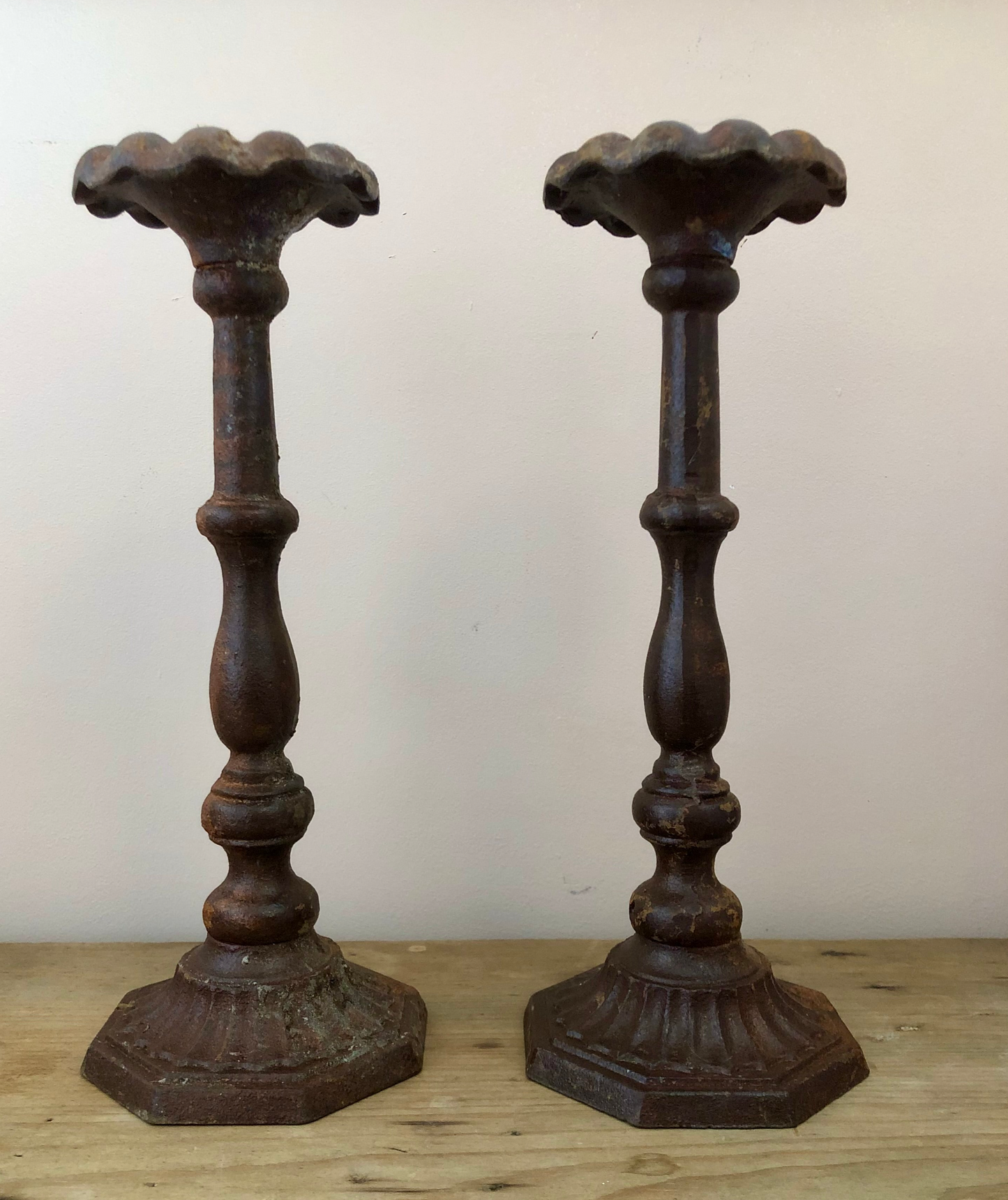 Pair of aged iron candlesticks